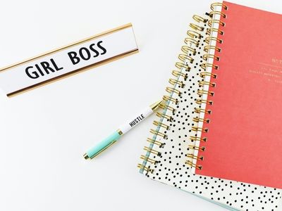 Planner, pen and girl boss label